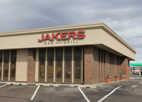 Exterior of Jakers Bar and Grill, featuring a modern design with large windows and a prominent sign.