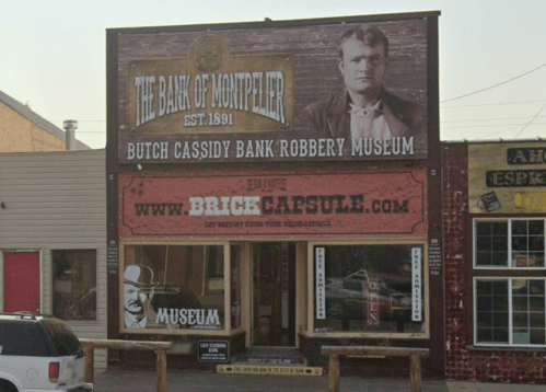 Sign for the Bank of Montpelier, featuring Butch Cassidy, advertising the Bank Robbery Museum.