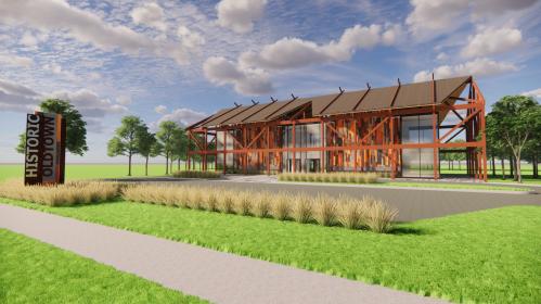 Modern building with wooden beams, large windows, and landscaped greenery, featuring a sign that reads "Historic Old Town."