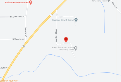 Map showing a location near Poulsbo Fire Department, with nearby streets and a red marker indicating a specific point.