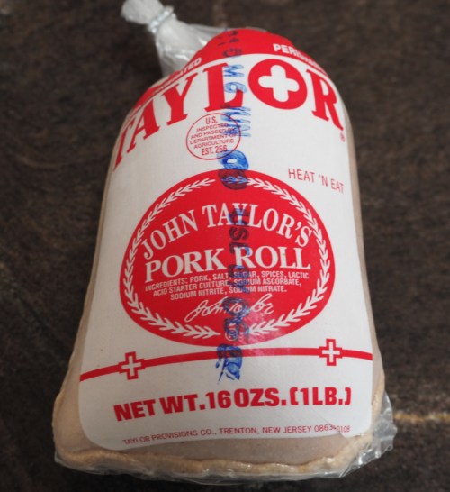 A package of John Taylor's Pork Roll, labeled with red and white branding, weighing 16 ounces.