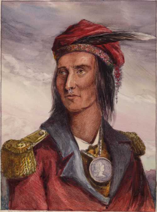 Portrait of a Native American man in a red hat and military-style coat, adorned with a medal and feather.