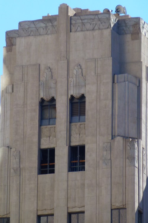 Art Deco building facade featuring intricate architectural details and geometric patterns.