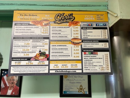 Menu board for Chris's Hot Dogs featuring to-go orders, prices for various items, and contact information.