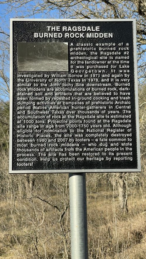 Sign about the Ragsdale Burned Rock Midden, detailing its archaeological significance and preservation efforts.
