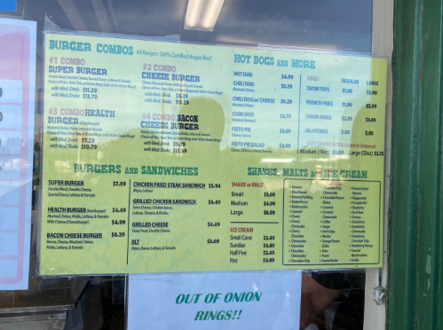 Menu board featuring burger combos, hot dogs, and shakes with prices listed. "Out of onion rings!" noted at the bottom.