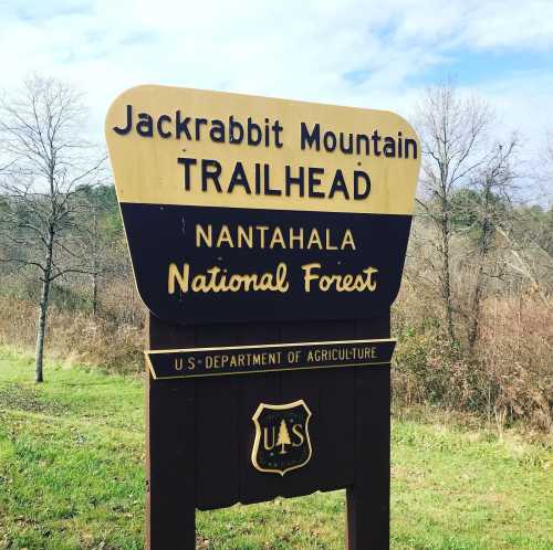 Sign for Jackrabbit Mountain Trailhead in Nantahala National Forest, featuring U.S. Department of Agriculture emblem.