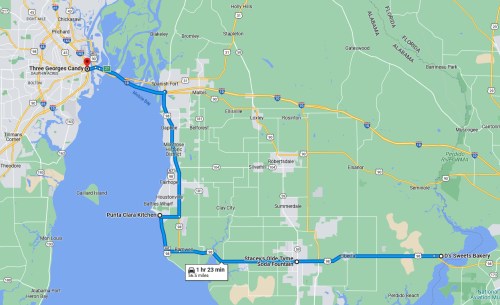 Map showing a route from Three Georges Candy to Doo's Sweets Bakery, highlighting key locations and highways.