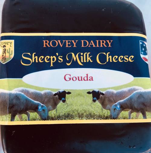 Label of Rovey Dairy's Sheep's Milk Gouda cheese, featuring a grassy background and images of sheep.