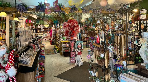 A colorful gift shop filled with decorations, crafts, and various merchandise, creating a vibrant and inviting atmosphere.