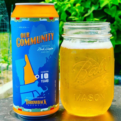 A can of "Our Community" Kolsch beer next to a mason jar filled with the same beer, set against a green background.
