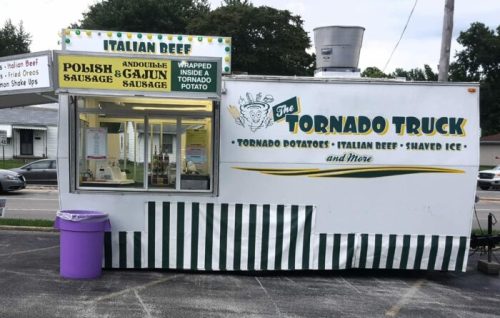 A food truck named "The Tornado Truck" offering tornado potatoes, Italian beef, and shaved ice, with a colorful exterior.