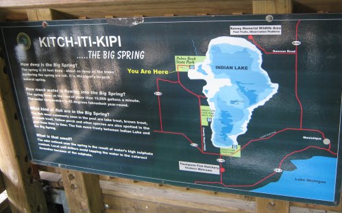 Map of Kitch-iti-kipi, detailing the Big Spring's depth, water flow, fish species, and surrounding areas.