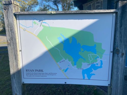 Map of Ryan Park, showing trails and water features in a green and blue layout, with park information at the bottom.