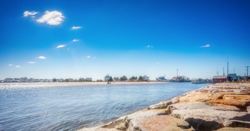 View of beautiful Bower Beach, Delaware, under a bright blue sky