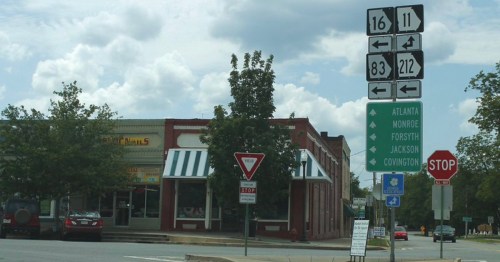 Highway signs on a street in downtown Monticello, Georgia