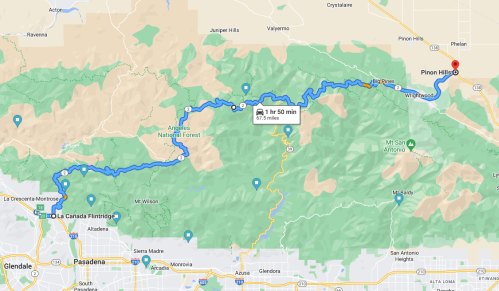 Map showing a route from Pasadena to Pine Hills, highlighting the Angeles National Forest area.