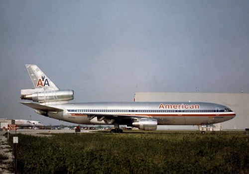 An American Airlines aircraft parked on the tarmac, showcasing its retro livery and design.