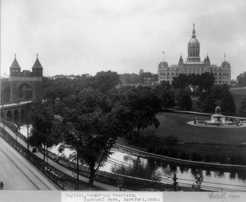 Historic black-and-white photo of the Connecticut State Capitol and fountain in Bushnell Park, Hartford.