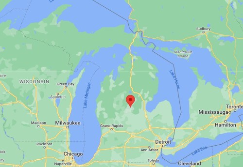 Map showing central Michigan with a red marker indicating a specific location. Surrounding areas include lakes and cities.