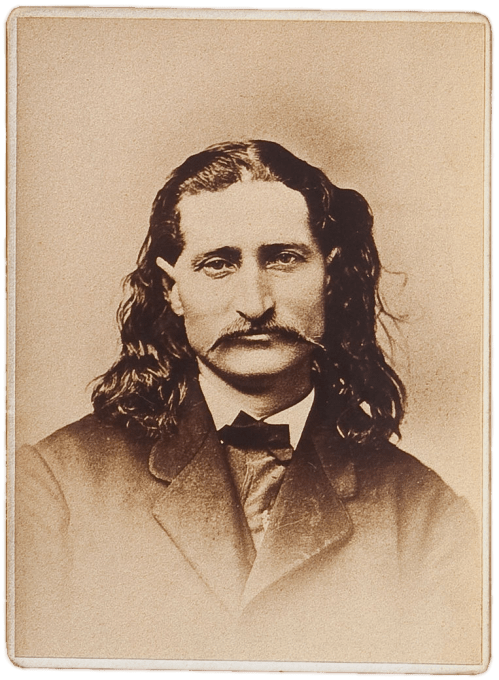 A sepia-toned portrait of a man with long hair and a mustache, wearing a suit and bow tie.