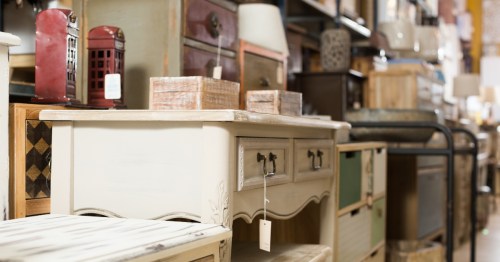 Dresser and other antique items for sale at an antique mall