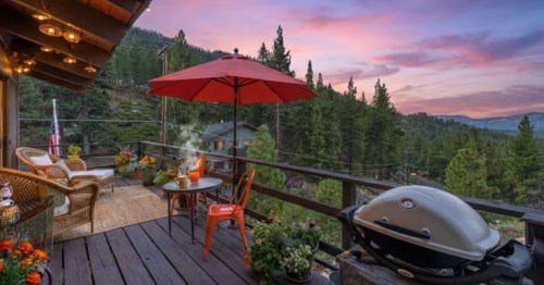 The view from a deck of a cabin in Northern California at sunset.