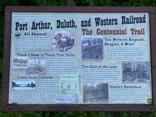Informational sign about the Port Arthur, Duluth, and Western Railroad, detailing its history and significance.