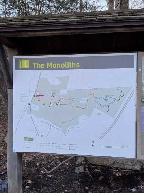 Map of The Monoliths trail area, showing paths in red, blue, and yellow, with surrounding features and north orientation.