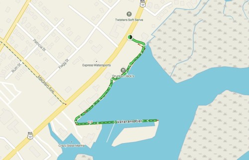 Map showing a route from a location near Express Watersports to Veterans Pier along a waterway.