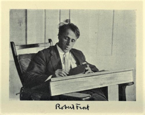 A man in a suit sits in a chair, writing in a notebook, with a focused expression. A signature reads "Robert Frost."