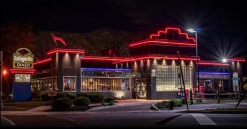 A brightly lit diner at night, featuring neon lights and a classic design, with a sign reading "Collegeville Diner."