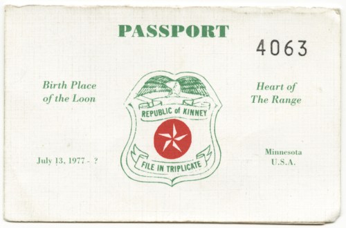 A passport from the Republic of Kinney, featuring a star emblem and text about its birth place and date.