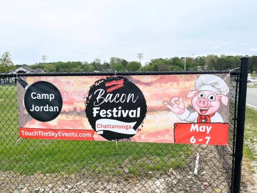 Banner for the Bacon Festival in Chattanooga, featuring a cartoon pig chef and event details: May 6-7 at Camp Jordan.