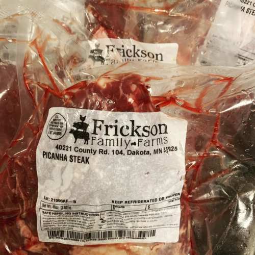 Packages of picanha steak from Frickson Family Farms, labeled with product details and handling instructions.