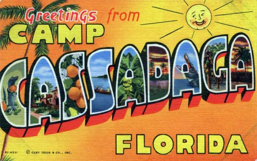 Colorful vintage postcard featuring "Greetings from Camp Cassadaga, Florida" with tropical imagery and a smiling sun.