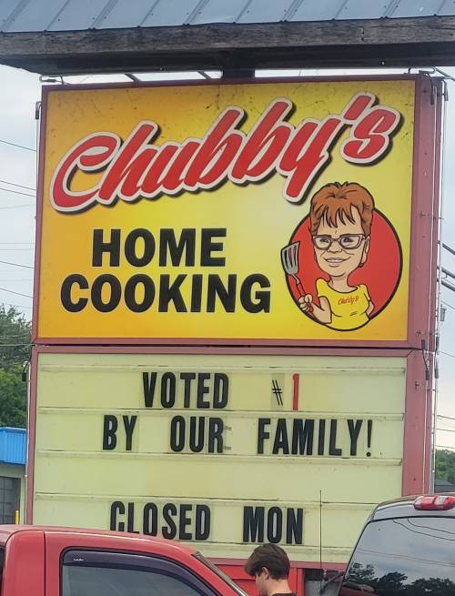 Sign for Chubby's Home Cooking featuring a cartoon chef, stating "Voted #1 by our family! Closed Mon."
