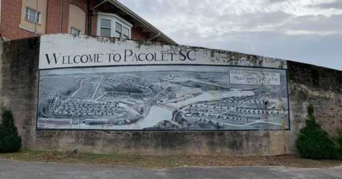 Mural welcoming visitors to Pacolet, SC, featuring a detailed landscape and historical depiction of the area.