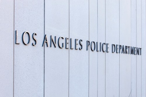 Sign for the Los Angeles Police Department on a modern building facade.