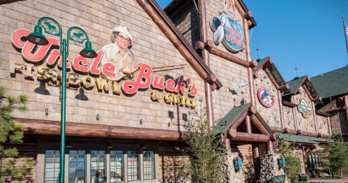 Exterior of Uncle Buck's Fish Bowl & Grill, featuring a rustic design and colorful signage.