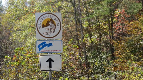 Sign for Wilderness Road with an arrow pointing up, surrounded by colorful autumn foliage. Date: 10/21/2015.