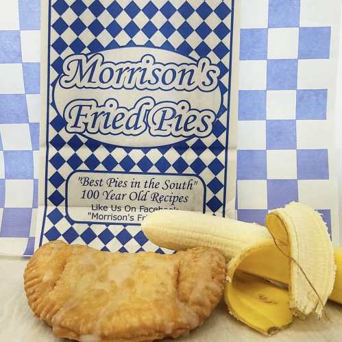 A fried pie from Morrison's, with a banana peel beside it, on a checkered blue and white background.