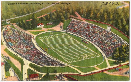 Aerial view of Sanford Stadium at the University of Georgia, filled with spectators during a football game.