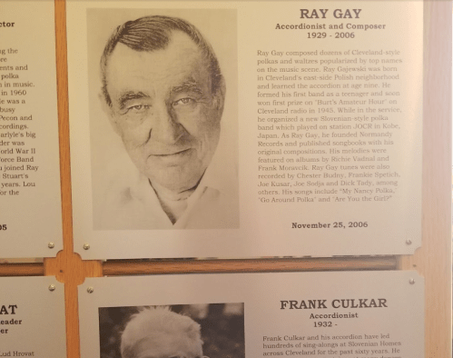 Black and white portrait of Ray Gay, accordionist and composer, with a brief biography and career highlights.