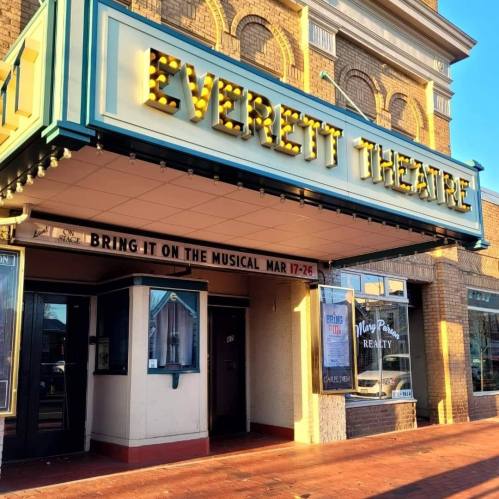 Exterior of Everett Theatre with marquee lights, announcing "Bring It On: The Musical" from March 17-26.