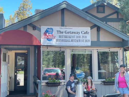 Exterior of The Getaway Cafe with a banner highlighting awards for best breakfast and overall restaurant from 2018-2020.
