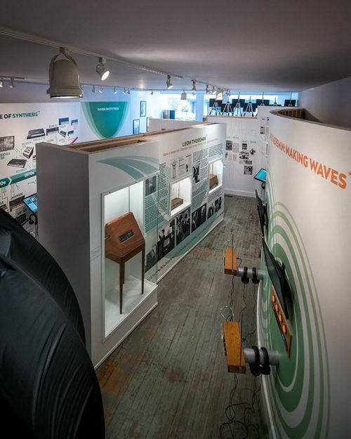 A spacious exhibition featuring displays and artifacts related to sound synthesis and music technology.