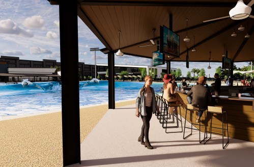 A beachside bar with patrons, overlooking a wave pool and palm trees under a partly cloudy sky.