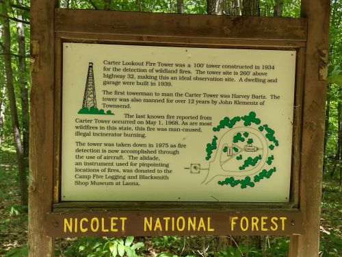 Sign about Carter Lookout Fire Tower in Nicolet National Forest, detailing its history and location.