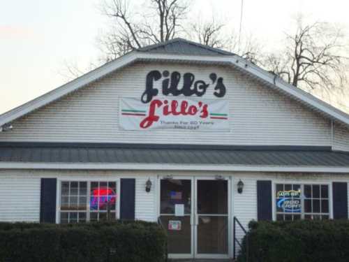 Exterior of Lillo's restaurant with a sign celebrating 60 years in business, featuring a green and red color scheme.